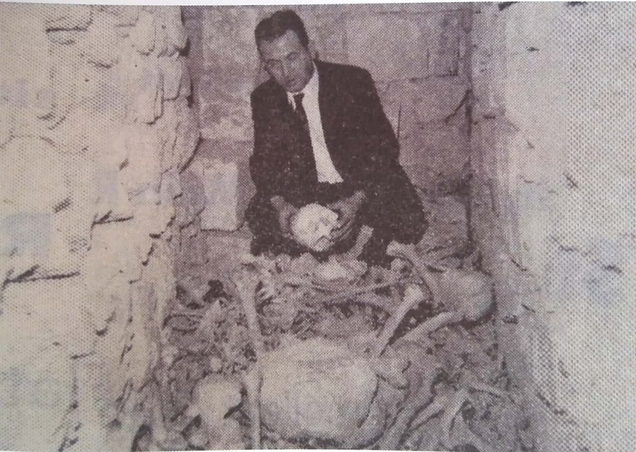 Ġan Mari Debono with the human bones discovered in 1969.